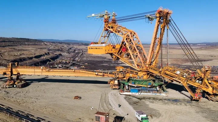Large-scale machinery operating in an open-pit mine